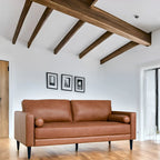 Canapé moderne en cuir véritable avec pieds en bois et coussin traversin supplémentaire