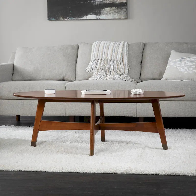 Table basse ovale marron/noire/blanche/grise, piètement en X, pieds recouverts de métal, montage par 1 personne