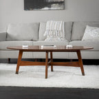 Table basse ovale marron/noire/blanche/grise, piètement en X, pieds recouverts de métal, montage par 1 personne