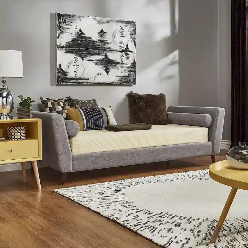 Lit de repos en lin beige/noir/gris avec traversins, style milieu de siècle, simple
